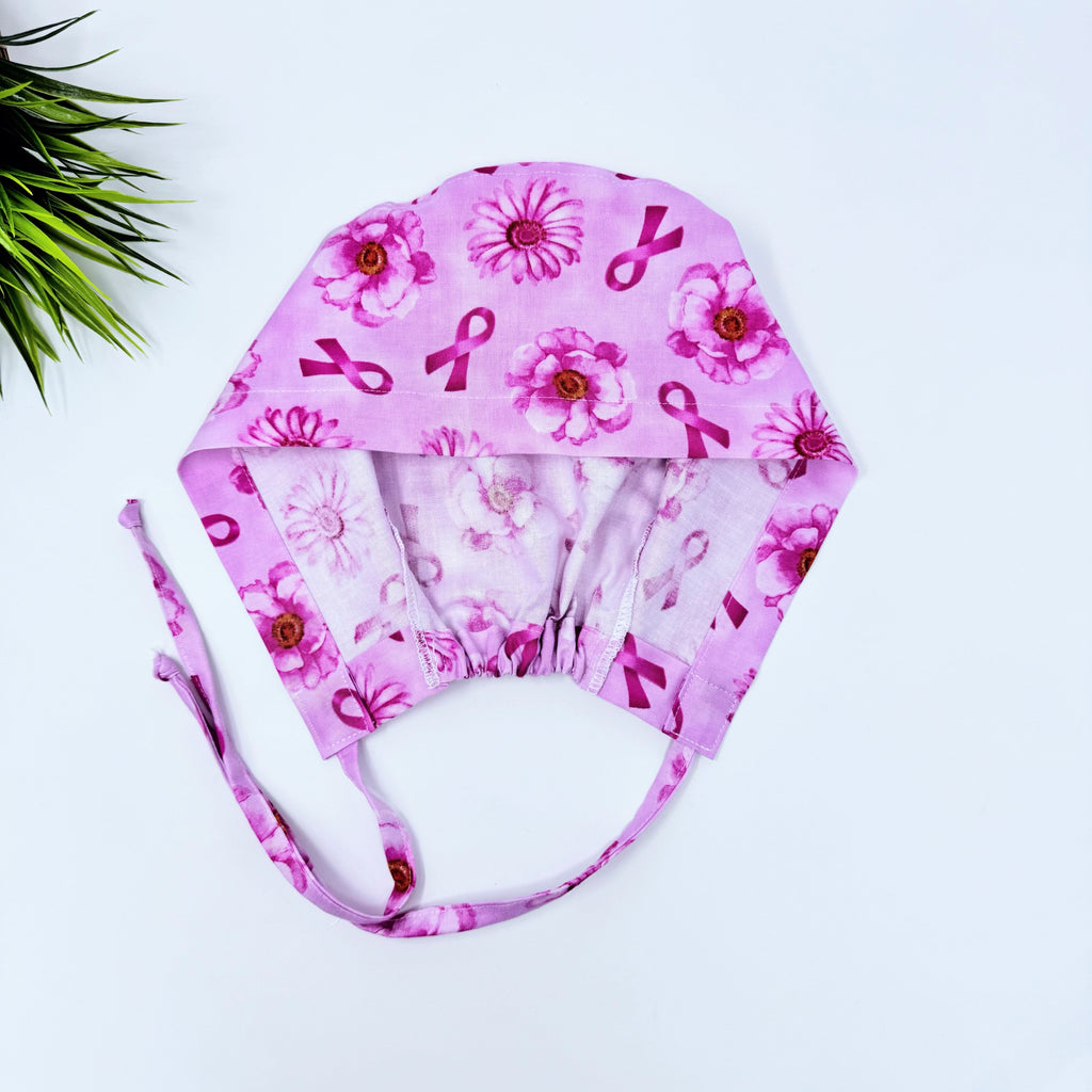 Pink Flower Skull tie-back style surgical scrub cap for men by Paradise Caps.