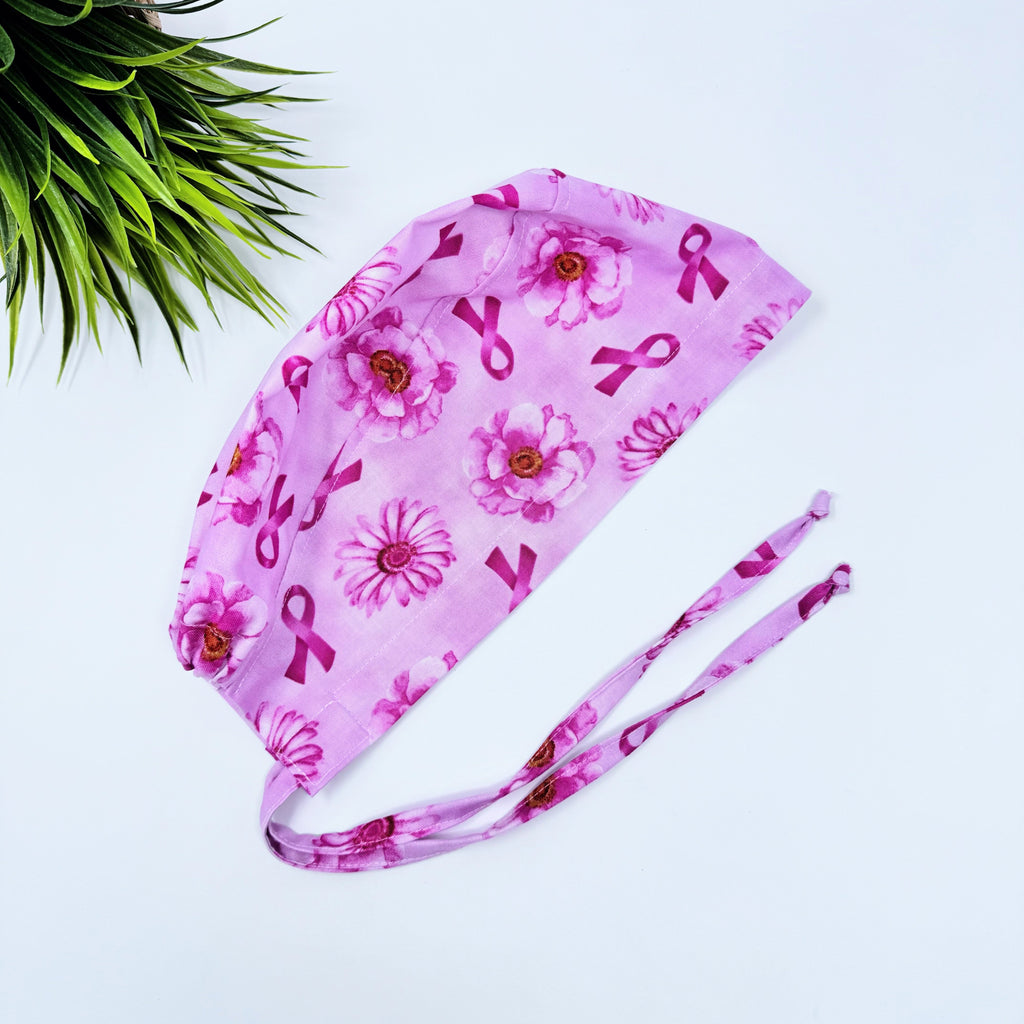 Pink Flower Skull tie-back style surgical scrub cap for men by Paradise Caps.