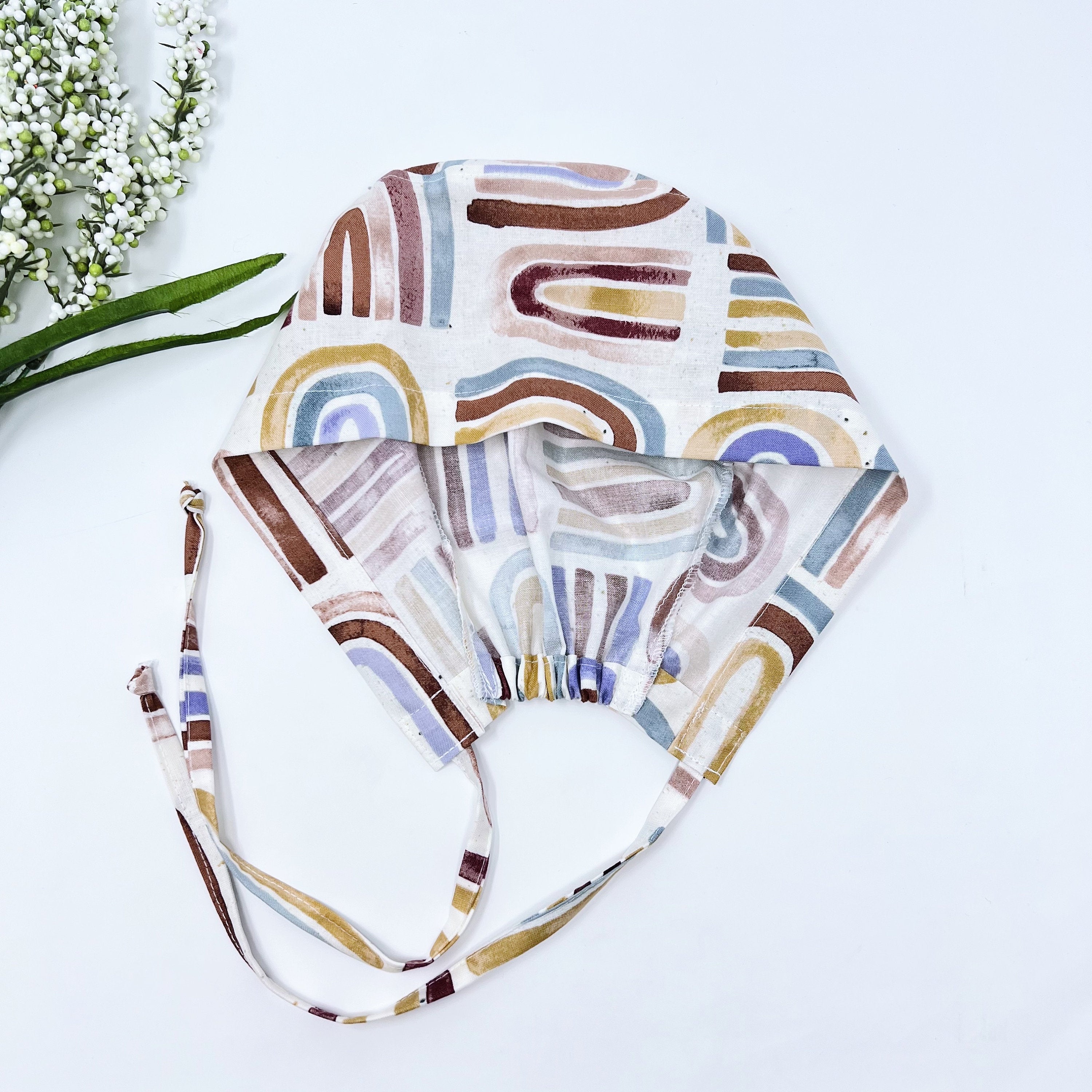 Rainbow Skull tie-back style surgical scrub cap for men by Paradise Caps.