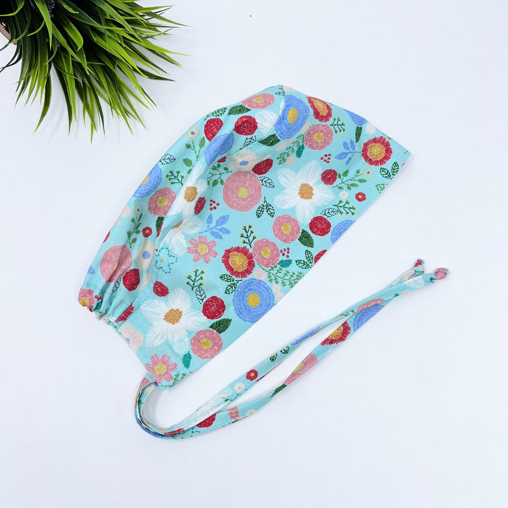 Green floral Skull tie-back style surgical scrub cap for men by Paradise Caps.