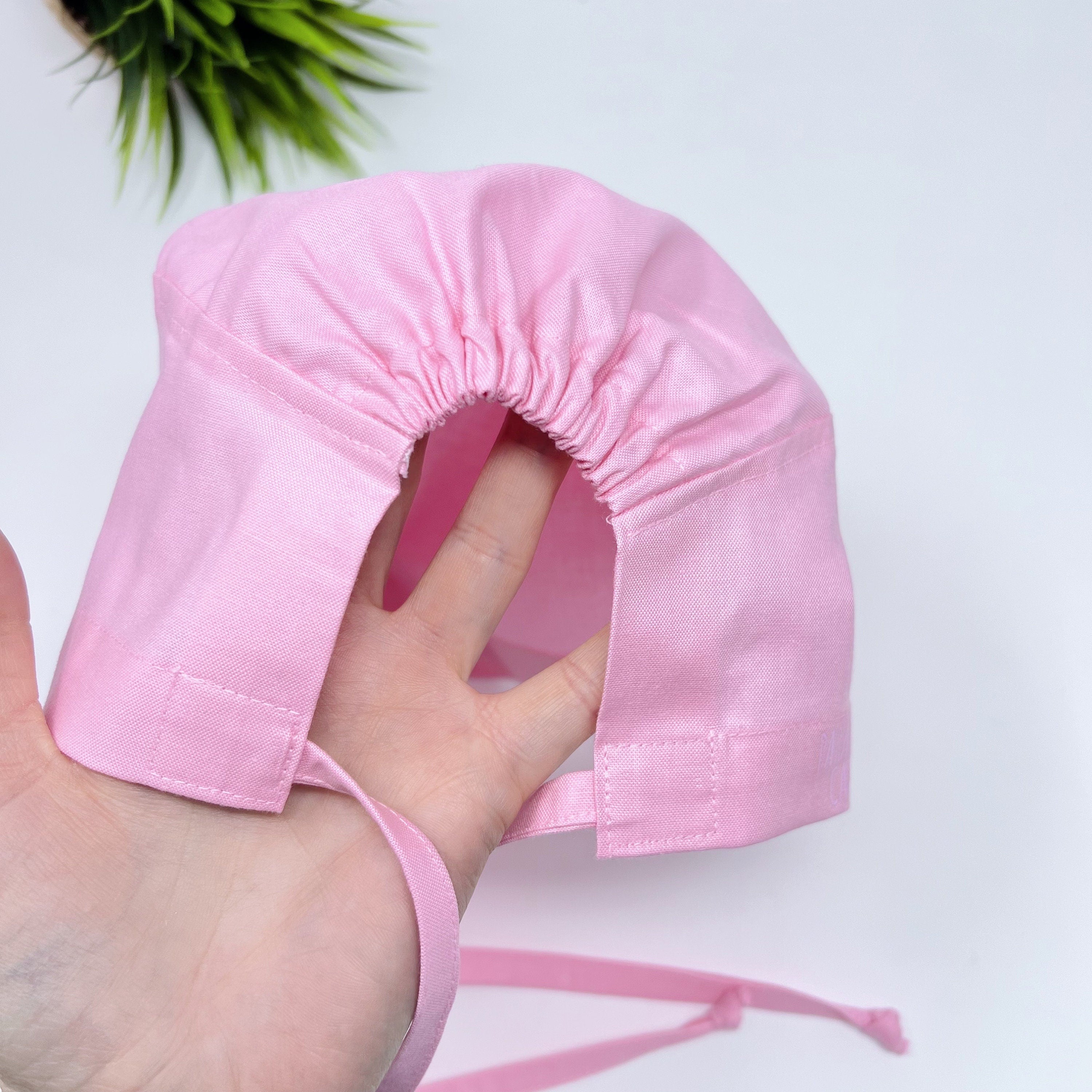 Solid pink Skull tie-back style surgical scrub cap for men by Paradise Caps.